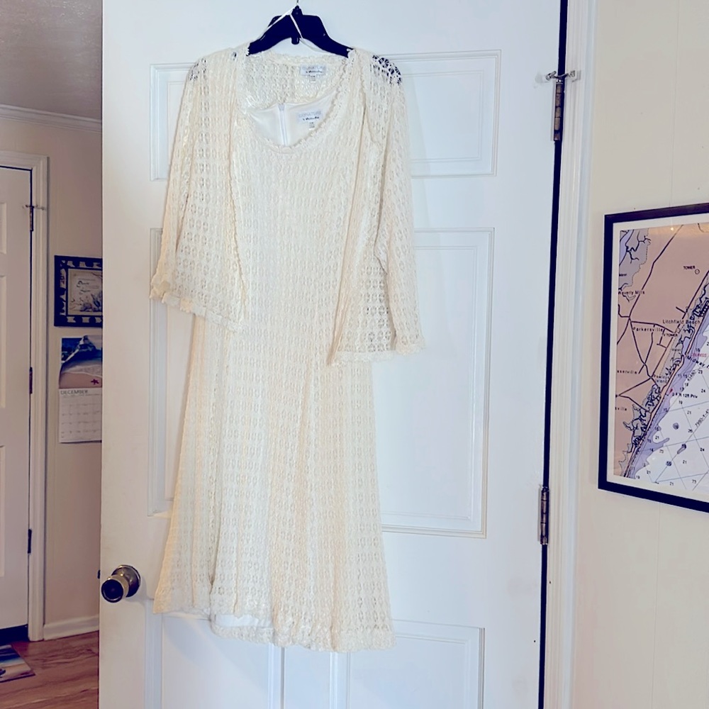 Beautifully detailed sleeveless dress with jacket. Dress is lined. Jacket  shear